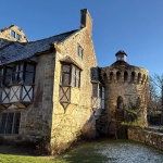 Scotney Castle with frozen lake in foreground