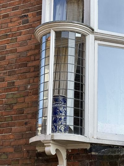 A spectacular round corner bay window on a house in Rye..