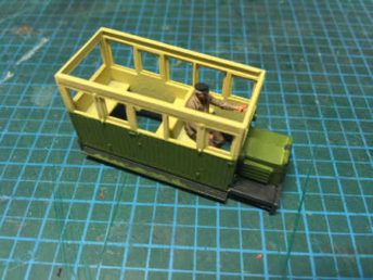 Railcar painted up in cream and green before weathering — driver is loose fitted at this point as the insides need painting.