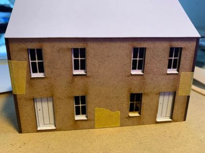 Laser-cut 2mm MDF cottages with laser-cut card doors and windows - unpainted.