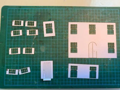 Laser-cut card for the windows and doors.