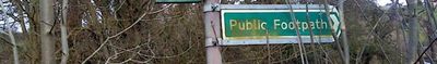 Overgrown Public Footpath sign in Medmenham.