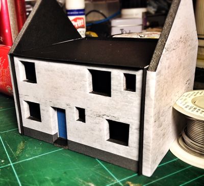 First building - whitewashed thick walled Cornish coastal cottage. Incomplete - no roof or windows.